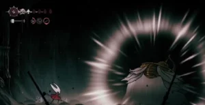 The Unravelled boss emerges with spear attack while Hornet prepares to dodge in the underground boss arena